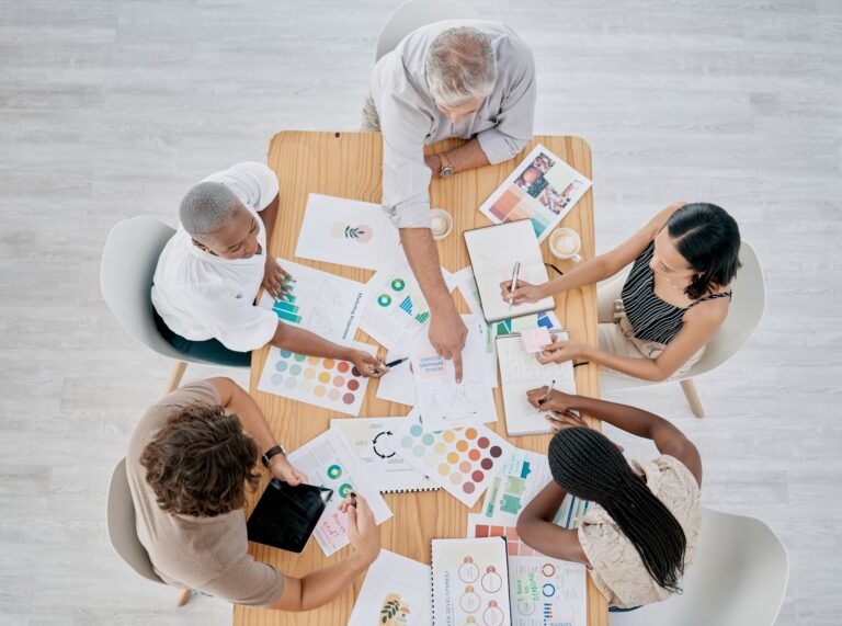 Team work, hands or creative business people in a meeting planning a logo, branding or marketing co